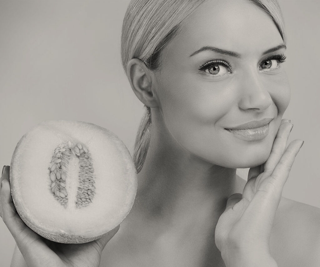 Smiling woman with her hair pulled back