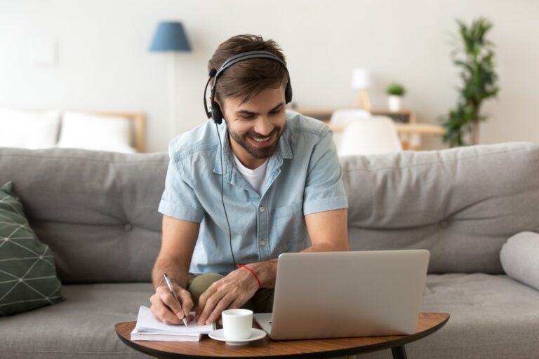 man working on laptop at home representing modern wellness business operations