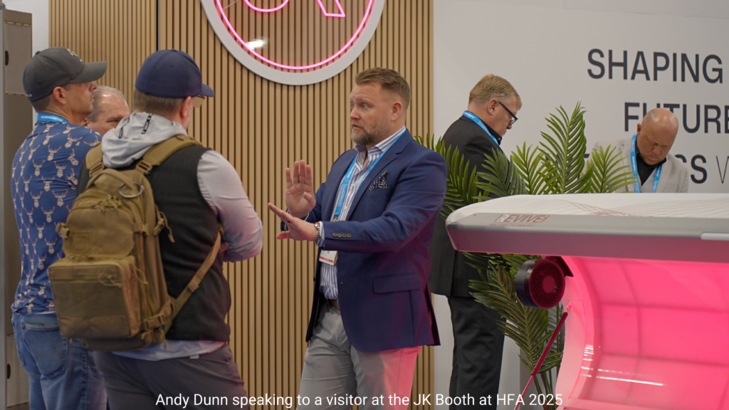Andy Dunn speaking to a visitor at the JK Booth at HFA 2025